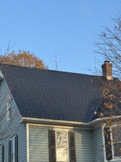 Completed dark architectural shingle roof