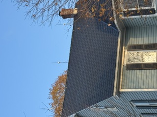 Completed dark architectural shingle roof