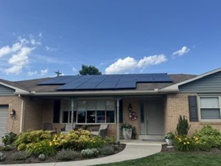 Completed residential roof with solar panels